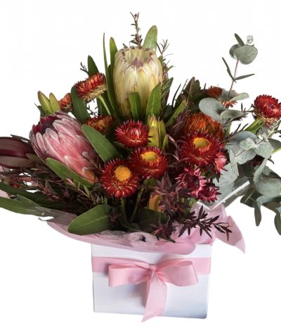 Wild Thing - Banksia, protea, native flowers are arranged .
