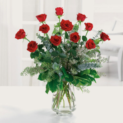 Pure Love - Beautiful long stemmed Red Roses or (other colour) in an elegant vase with greenery 
